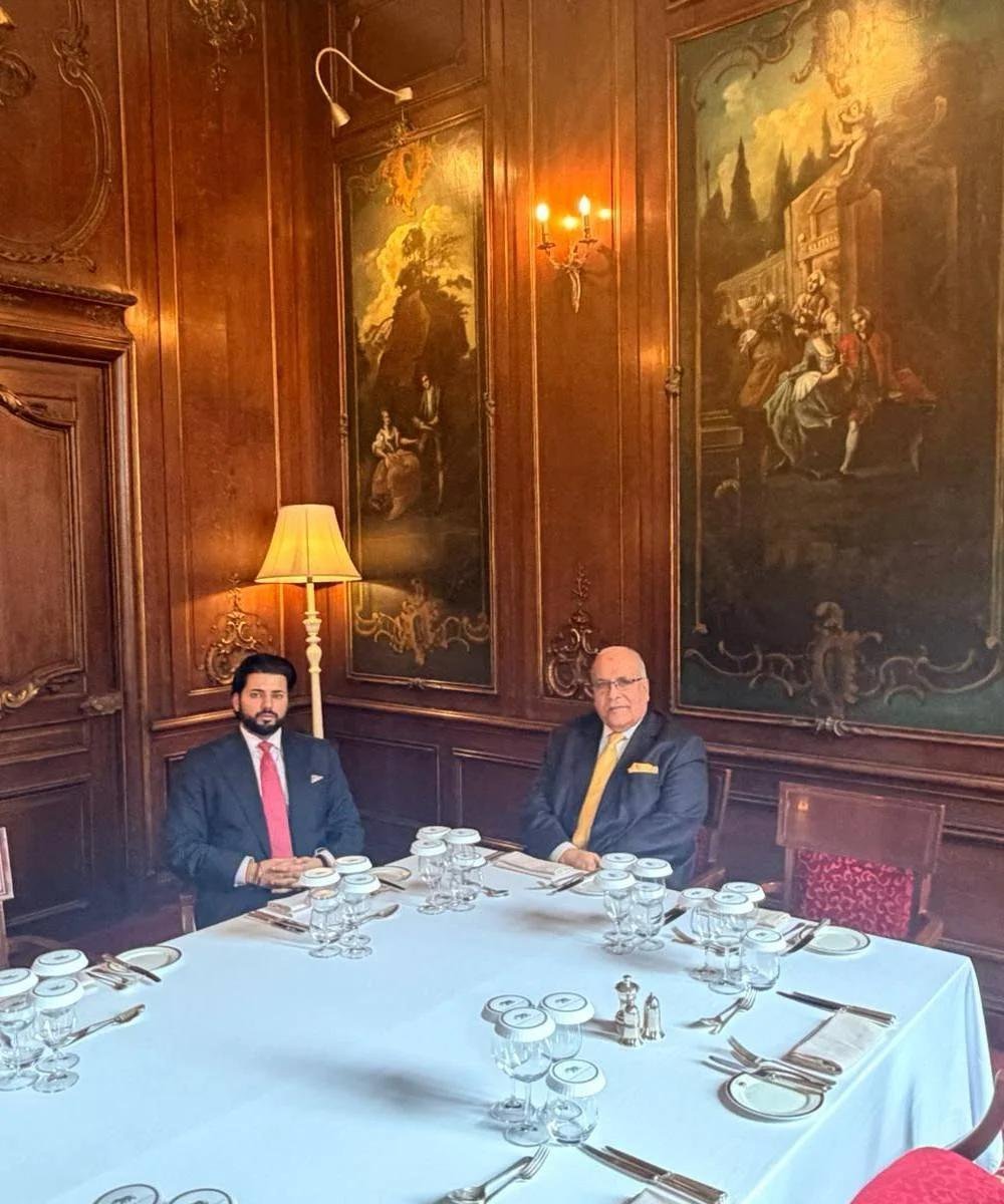 Two principals of the Group in a private dining room, London.