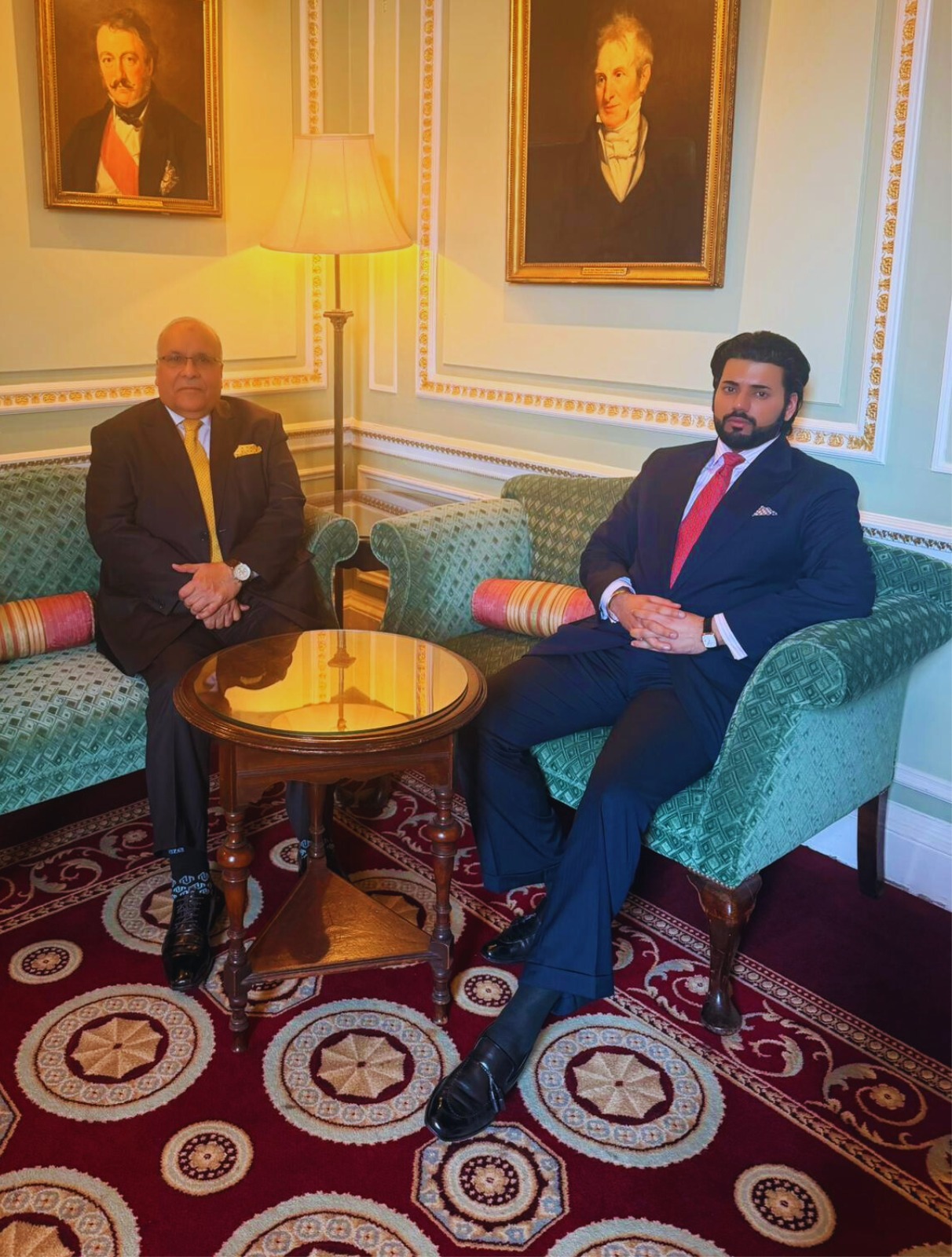 Xyra Group principals standing in a grand room