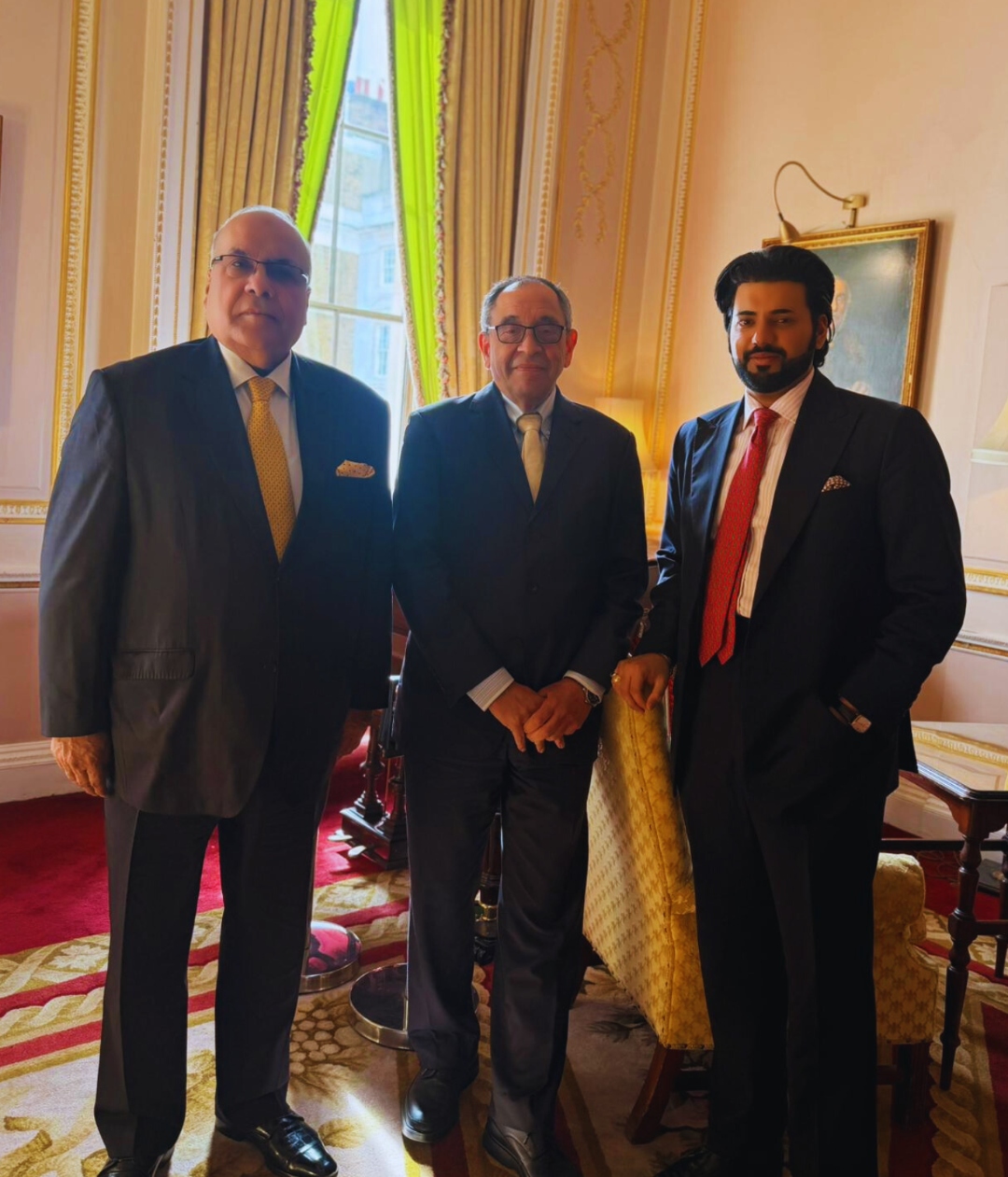 Xyra Group principals standing in a grand room