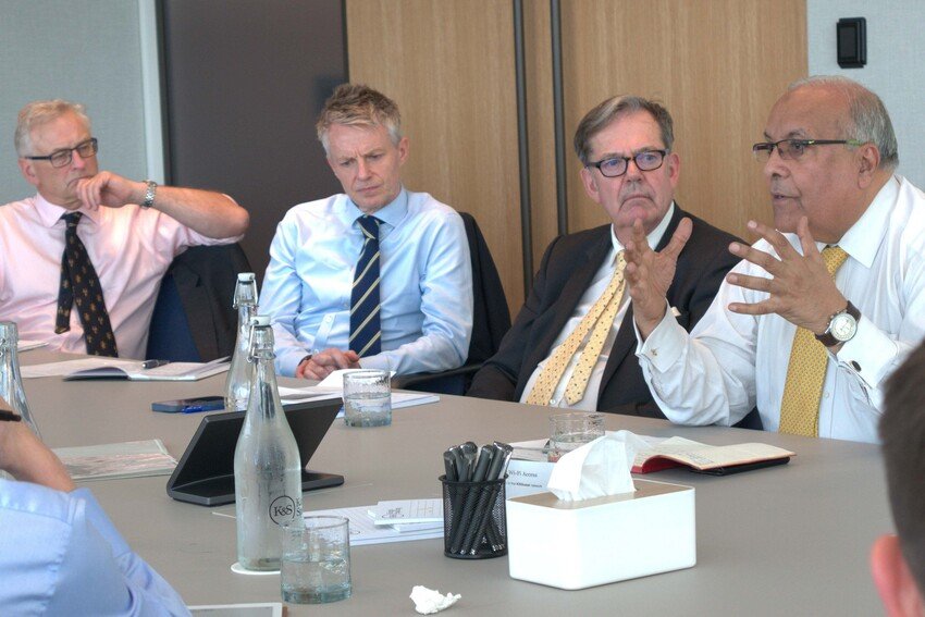 Xyra Group Investment Committee at boardroom table